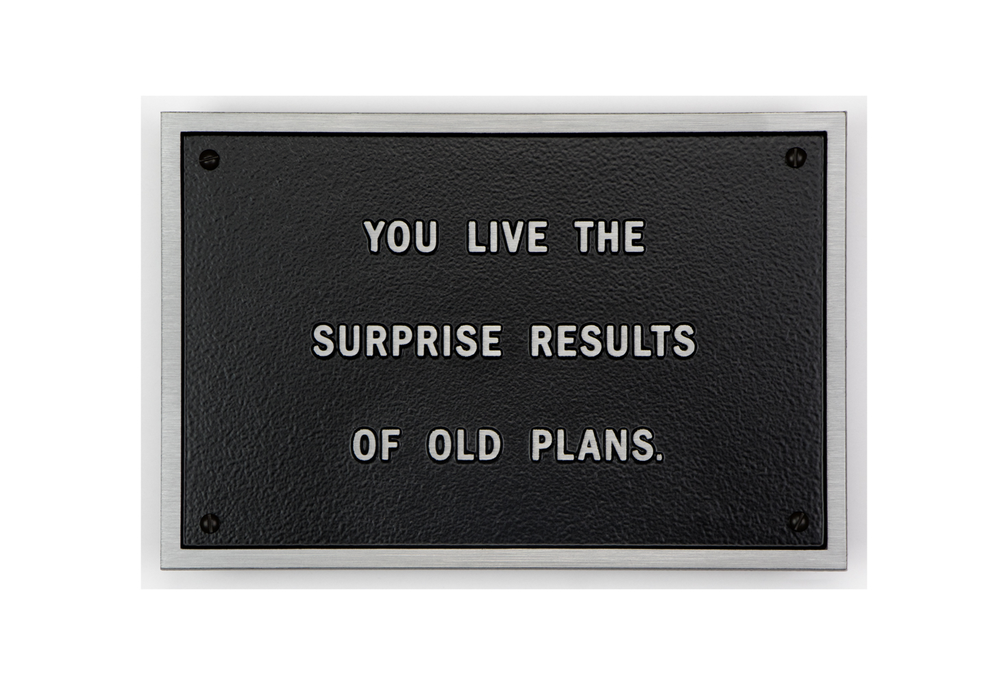 Jenny Holzer plaque that says: You live the surprise results of old plans